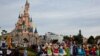 (FILES) Disney cast members take part in a parade during a ceremony marking the 100th anniversary of the Walt Disney Company, held at Disneyland Paris, in Marne-la-Vallee, east of Paris, on October 16, 2023.